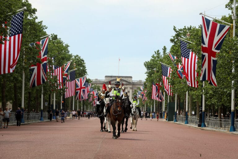 Police officers and Guardsman from the Horse Guards move past U.S. and British flags as they stretch along The Mall towards Buckingham Palace in central London in advance of U.S. President Donald Trump State visit to Britain, London, Britain June 2, 2019. REUTERS/Simon Dawson